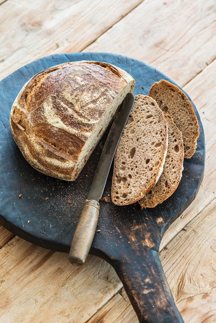 Bread, sliced, on a wooden board