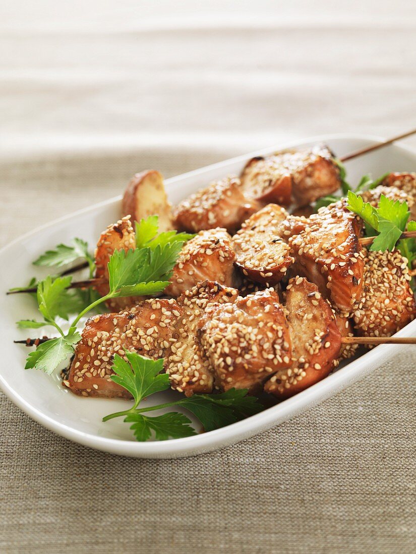Salmon and apple skewers with soy, ginger and sesame seeds