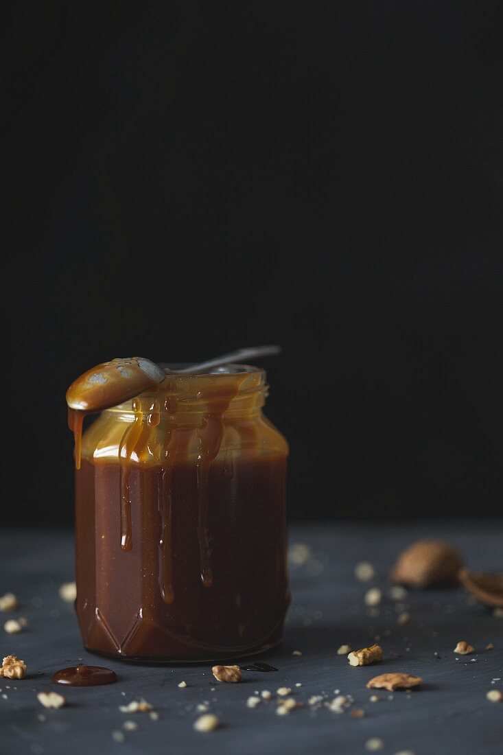 A jar of dark caramel sauce