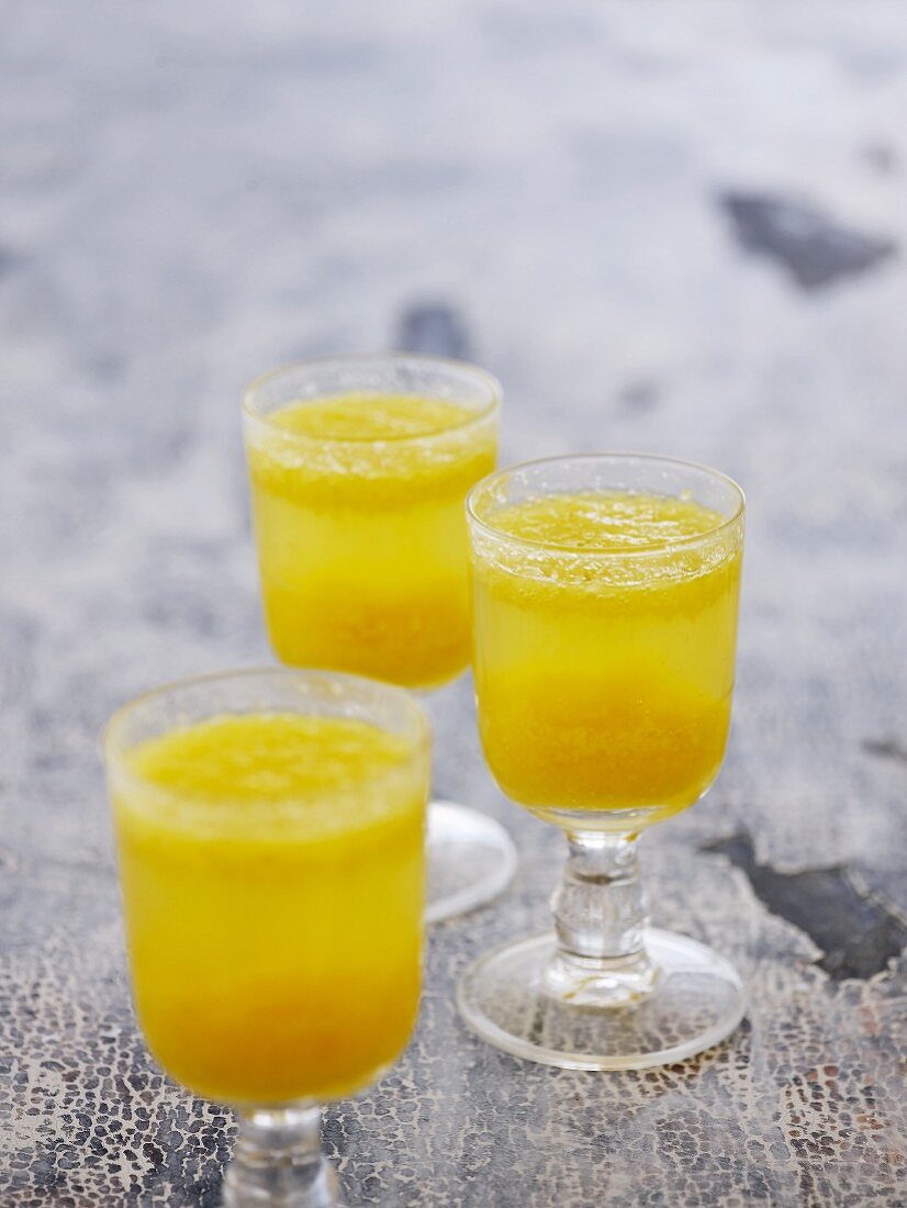 Fizzy cocktails with orange juice, rum and mineral water