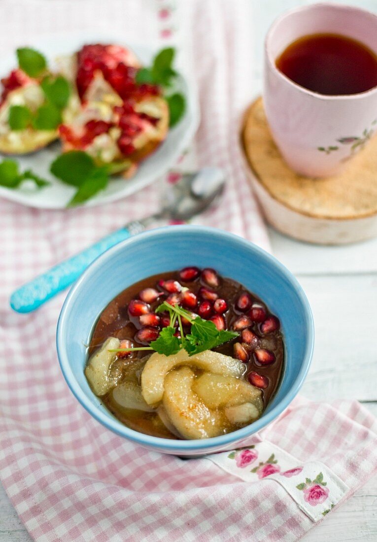 Chocolate porridge with pears and pomegranate seeds