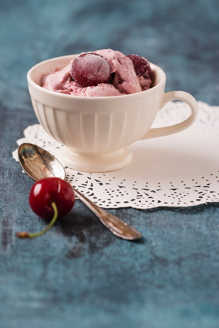 Homemade cherry ice cream in a cup