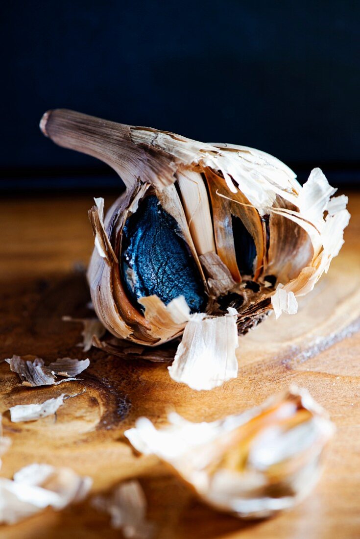Black garlic on a wooden table