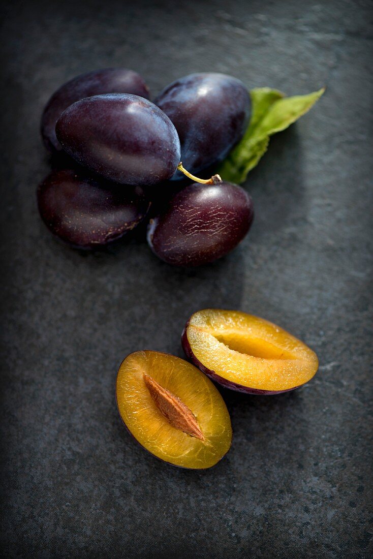 Fresh plums on a slate platter