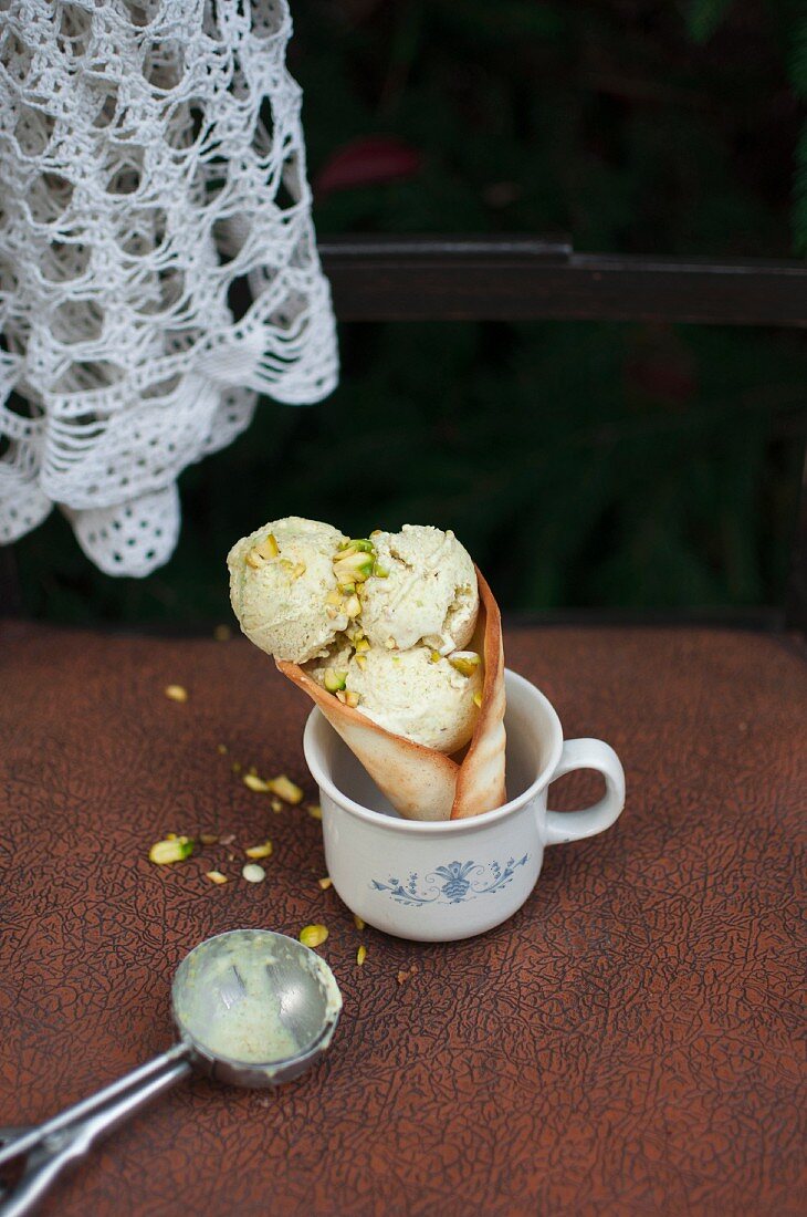 Homemade pistachio ice cream in a cone