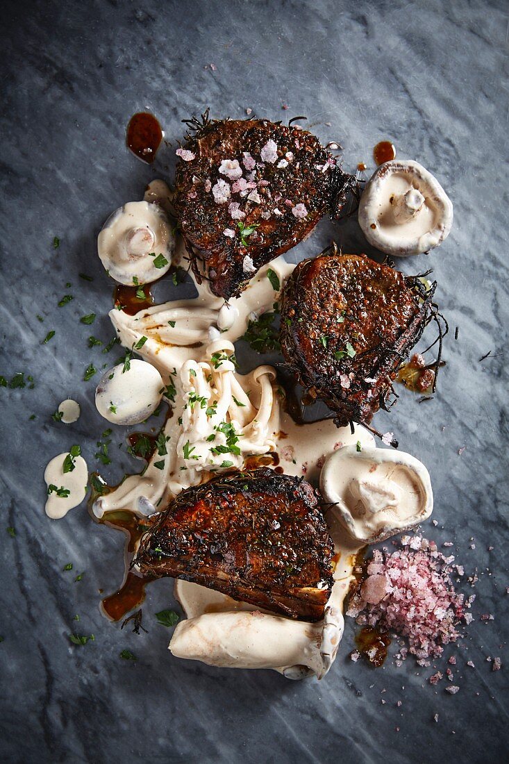 Pork fillets on the bone with creamy whiskey mushrooms