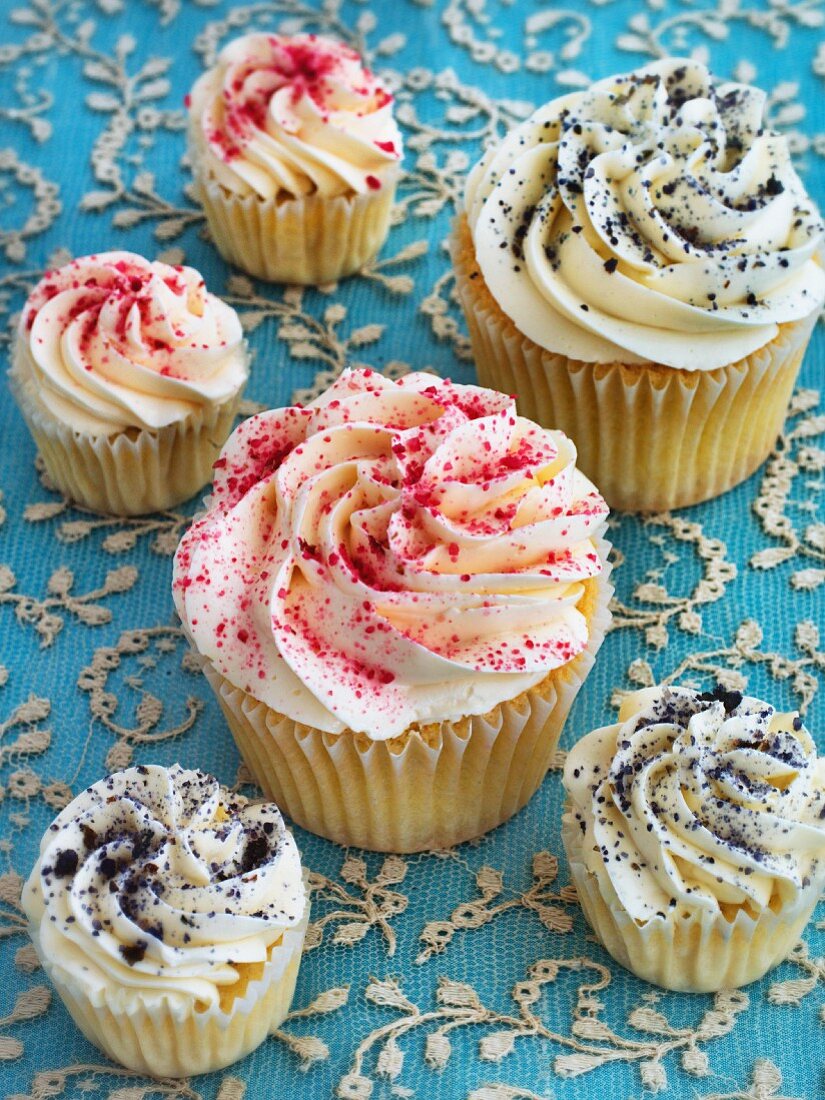 Cupcakes decorated with cream and coloured sugar