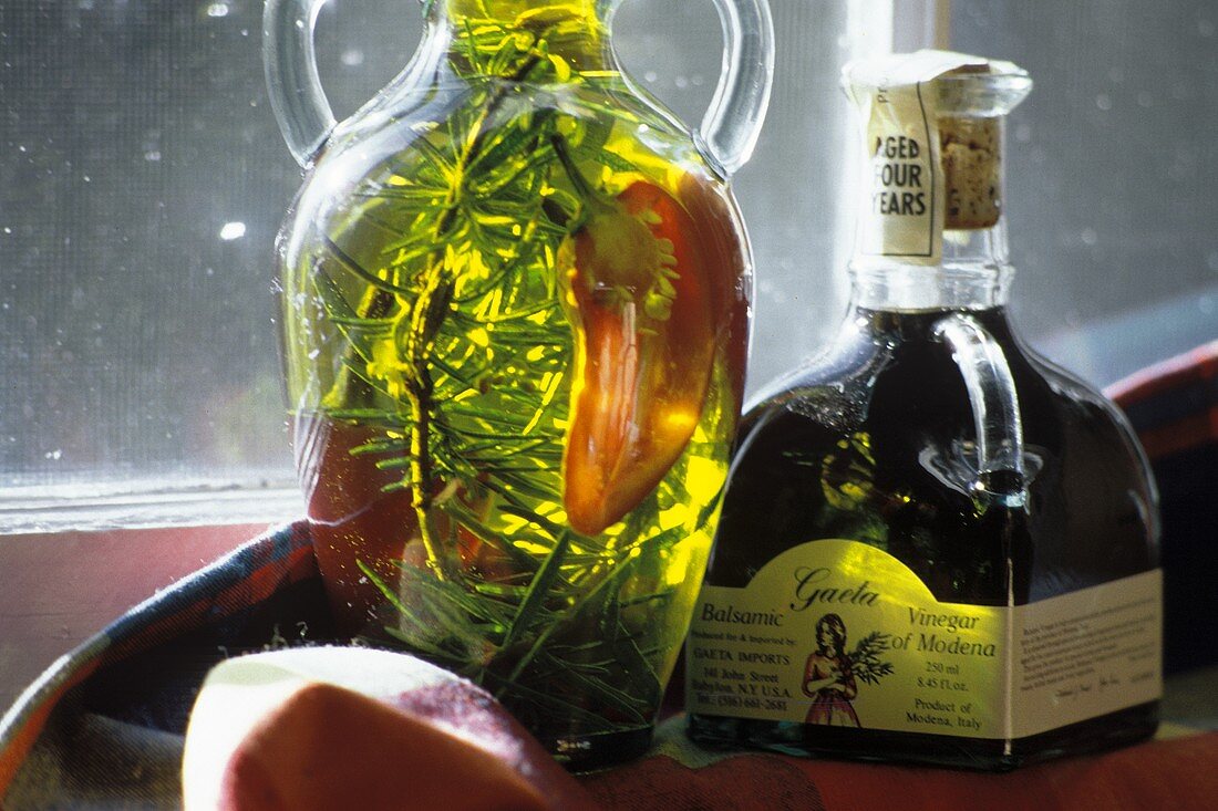 Bottle of olive oil, fresh thyme & pepper & gaeta vinegar