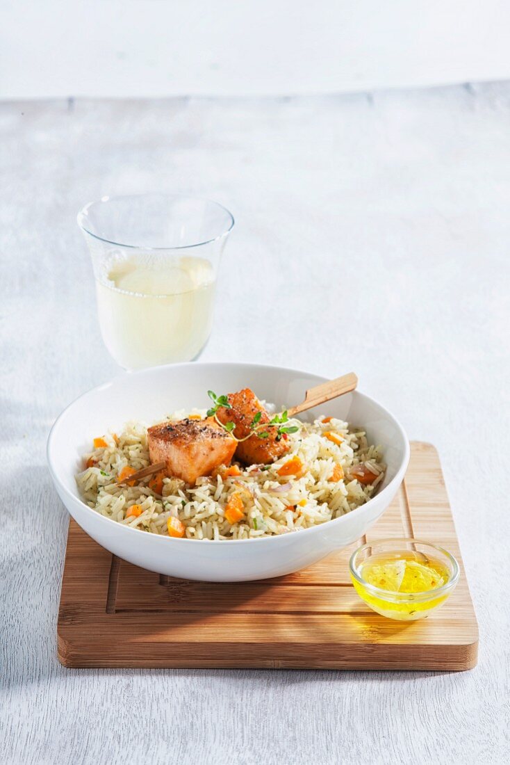 Salmon skewers on spicy rice