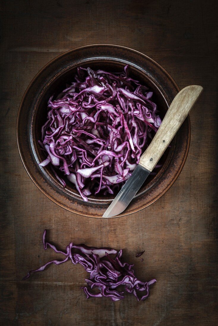 A bowl of freshly grated red cabbage (seen from above)