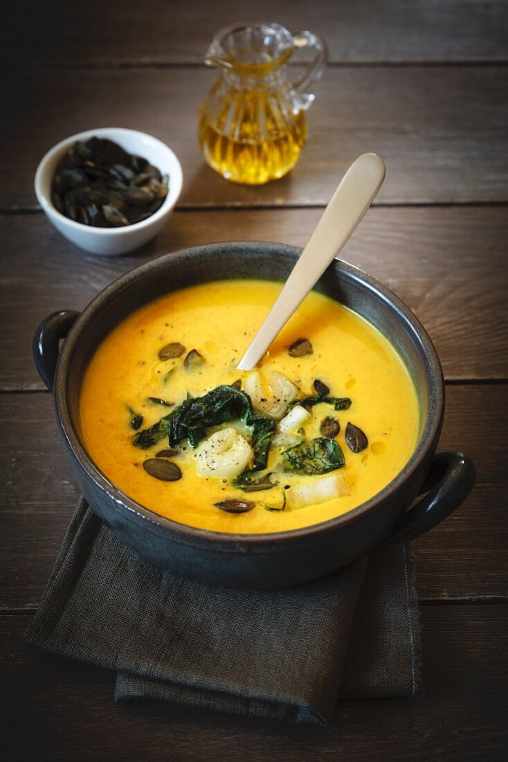 Pumpkin soup with roasted bok choy and pumpkin seeds