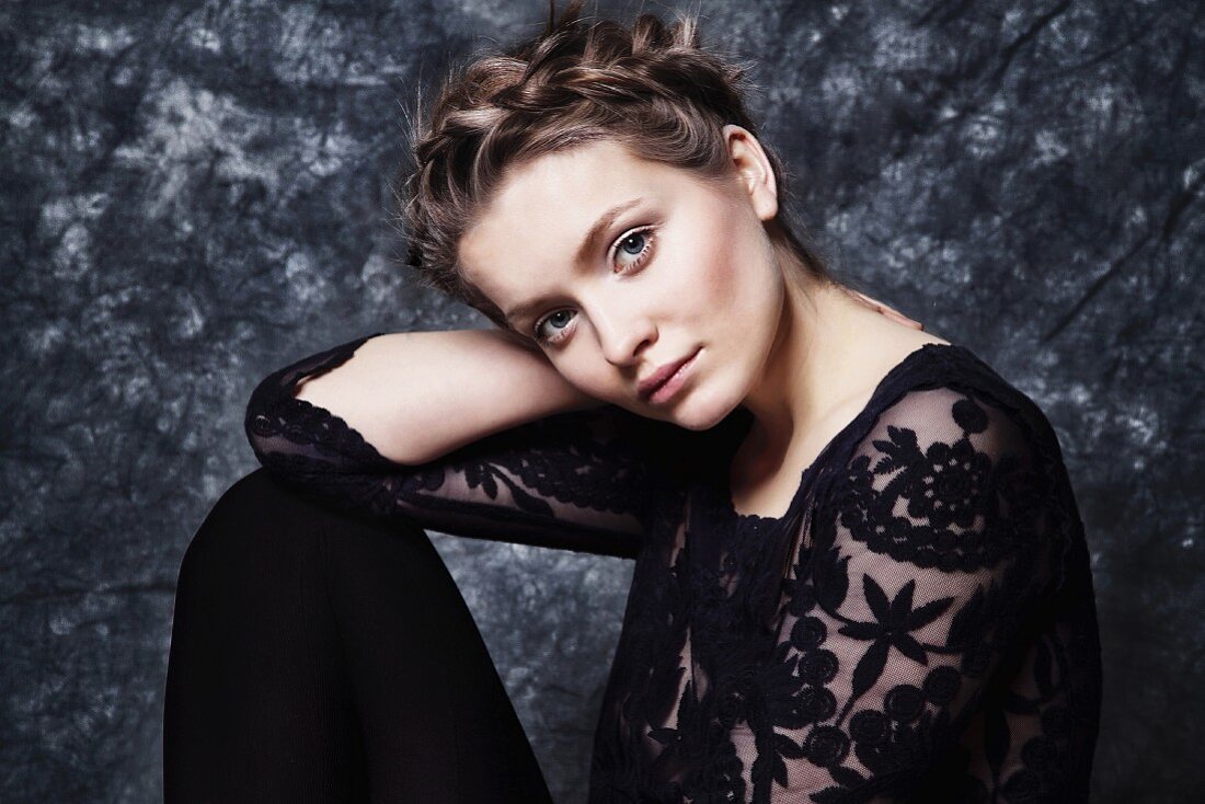 Young woman wearing black lace top