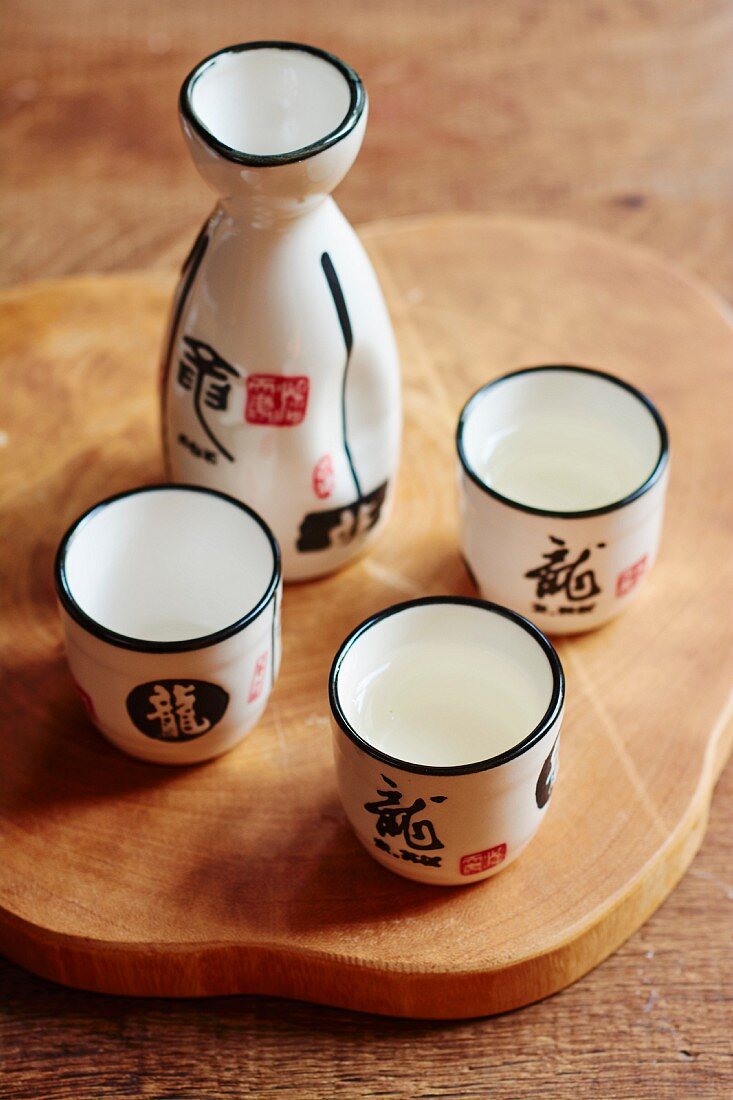 Sake set with three sake bowls and a carafe (Asia)