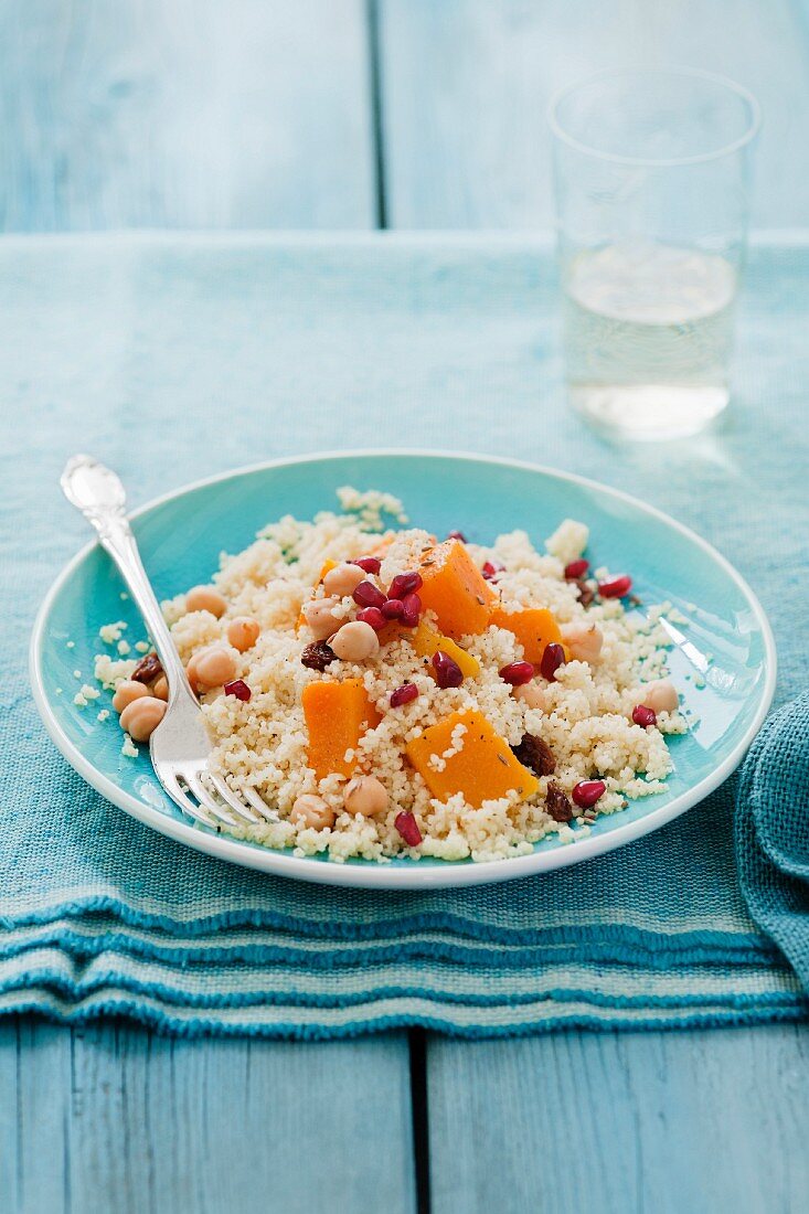 Couscous with butternut squash, chick peas, raisins, pomegranate seeds and cumin