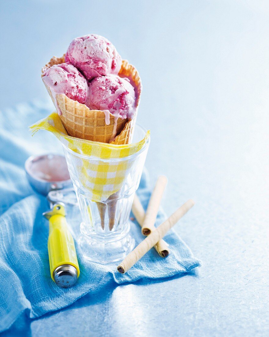 Plum and raspberry ice cream in a cone