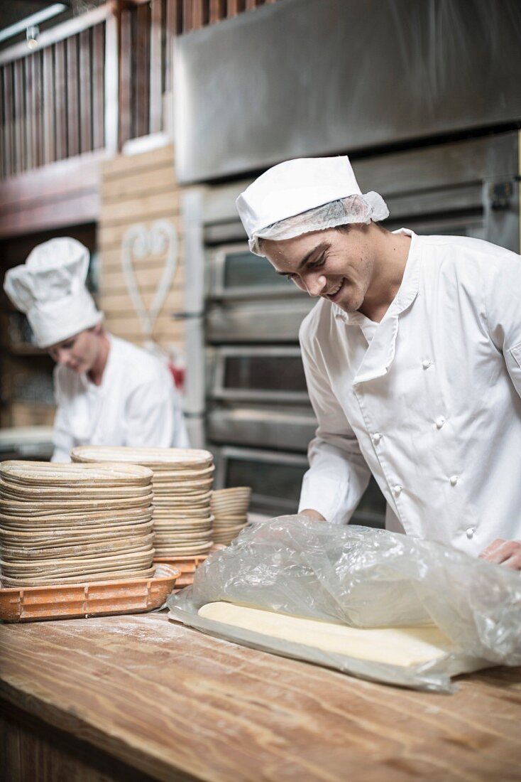 Baker and a bakery preparing dough