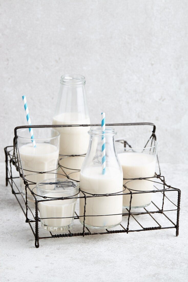 Vegan almond milk in a bottle basket