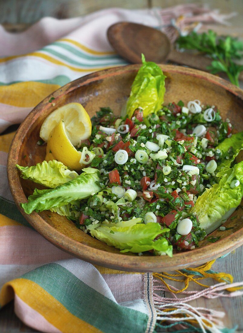 Tabbouleh in a wooden bowl