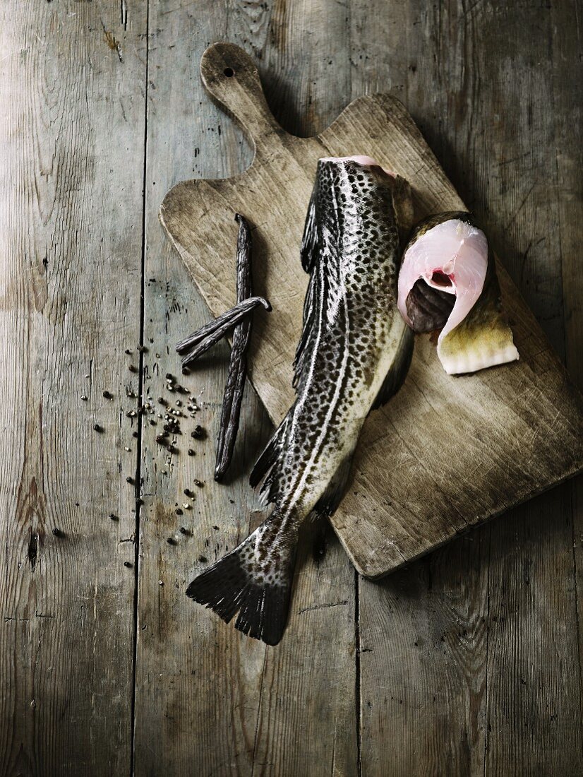 An arrangement featuring trout, vanilla pods and pepper