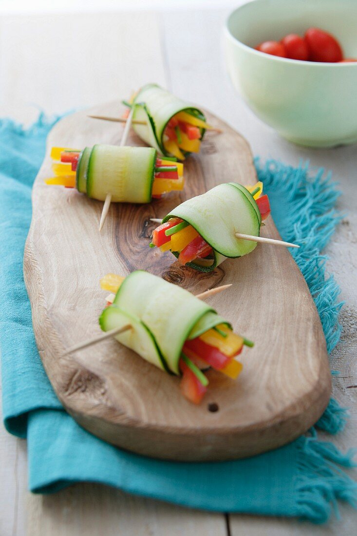 Courgette rolls filled with coloured peppers and chives