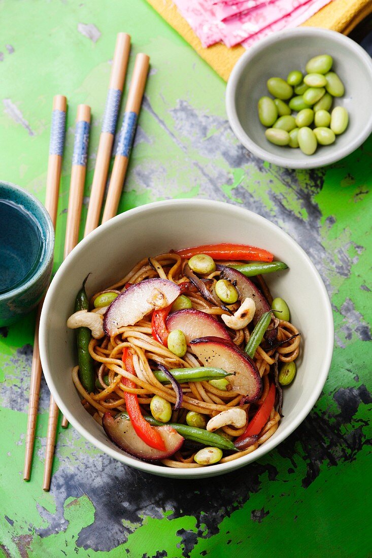 Noodles with beans, peppers, plums and cashew nuts with a soya dressing