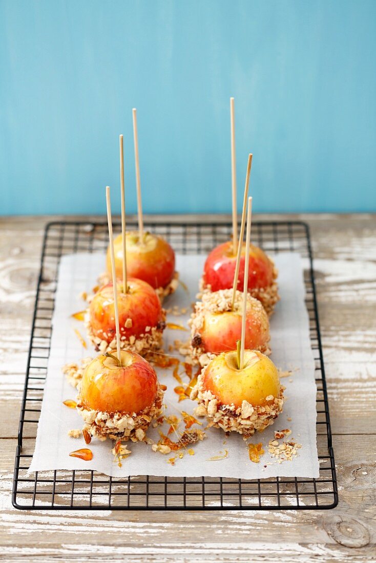 Toffee apples with chopped nuts
