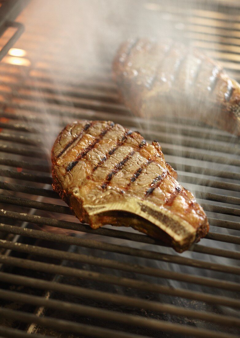 Grilled pork chops on a barbecue