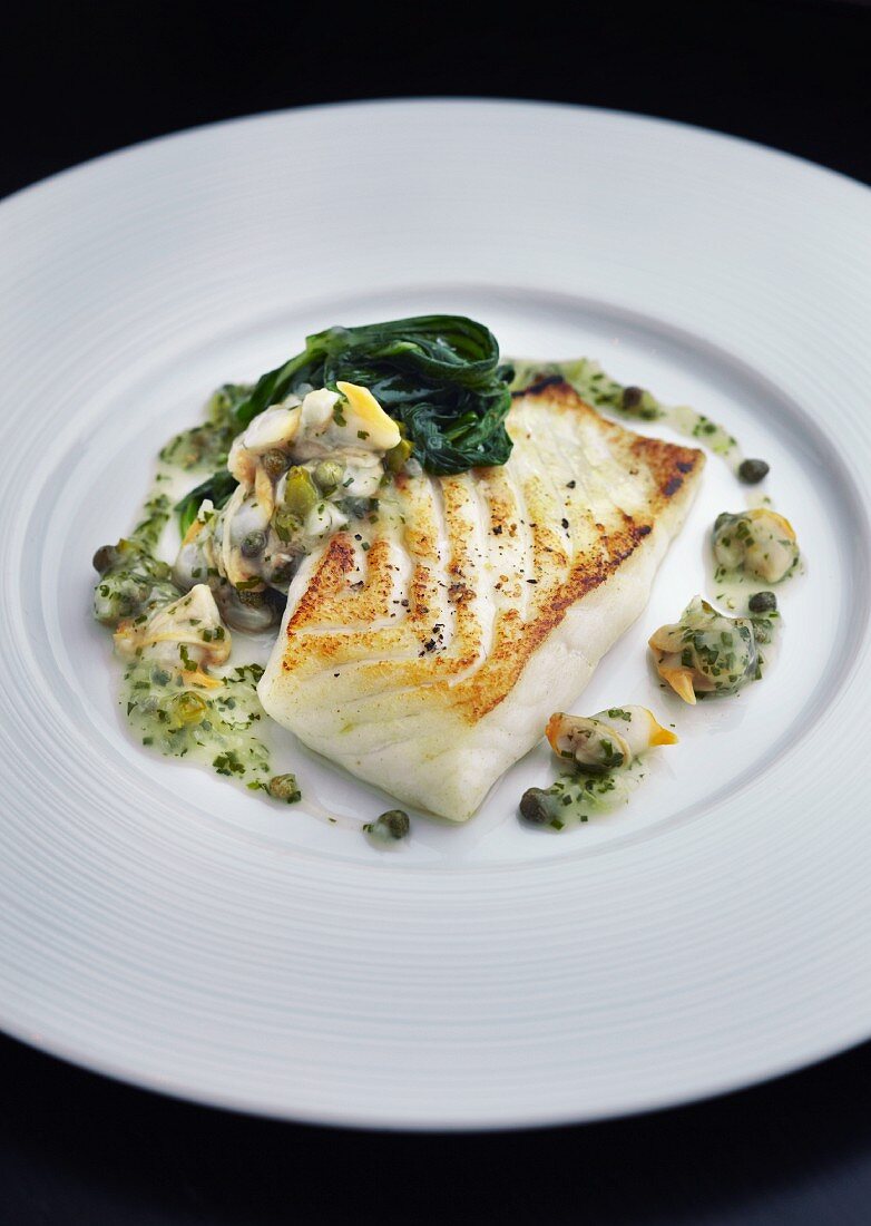 Turbot fillet with spinach and a caper sauce