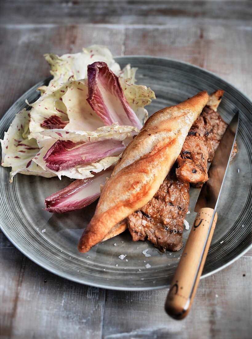 A steak sandwich with radicchio