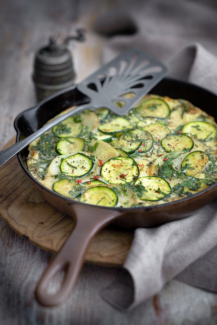 Courgette frittata in a pan