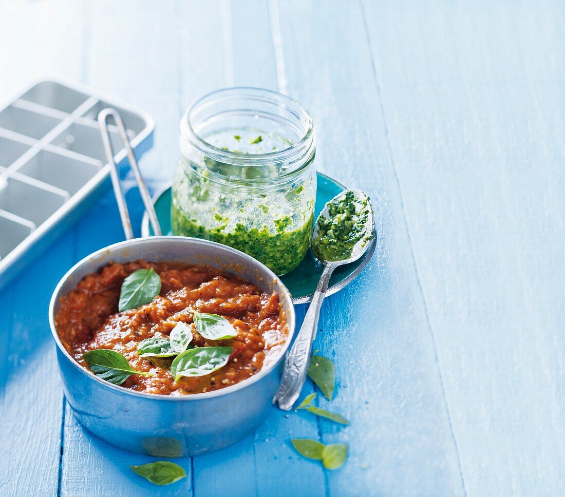 Basil pesto and tomato sauce with basil leaves