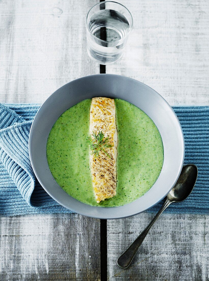 Cold avocado soup with fish steak
