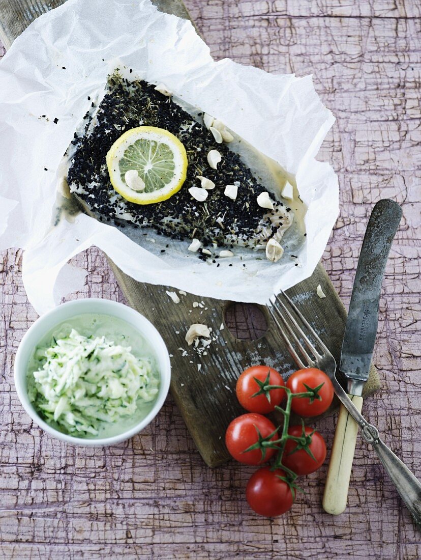 Fish fillets with a herb crust in parchment paper
