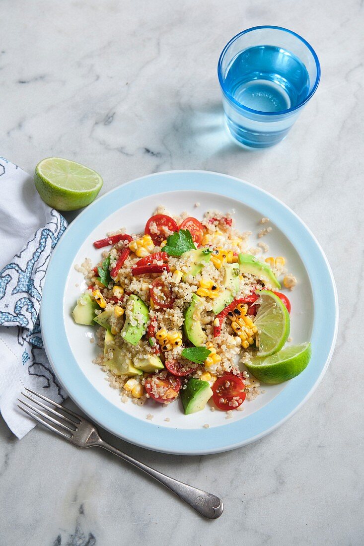 Quinoa salad with grilled corn, avocado, tomatoes, chilli, peppers and limes
