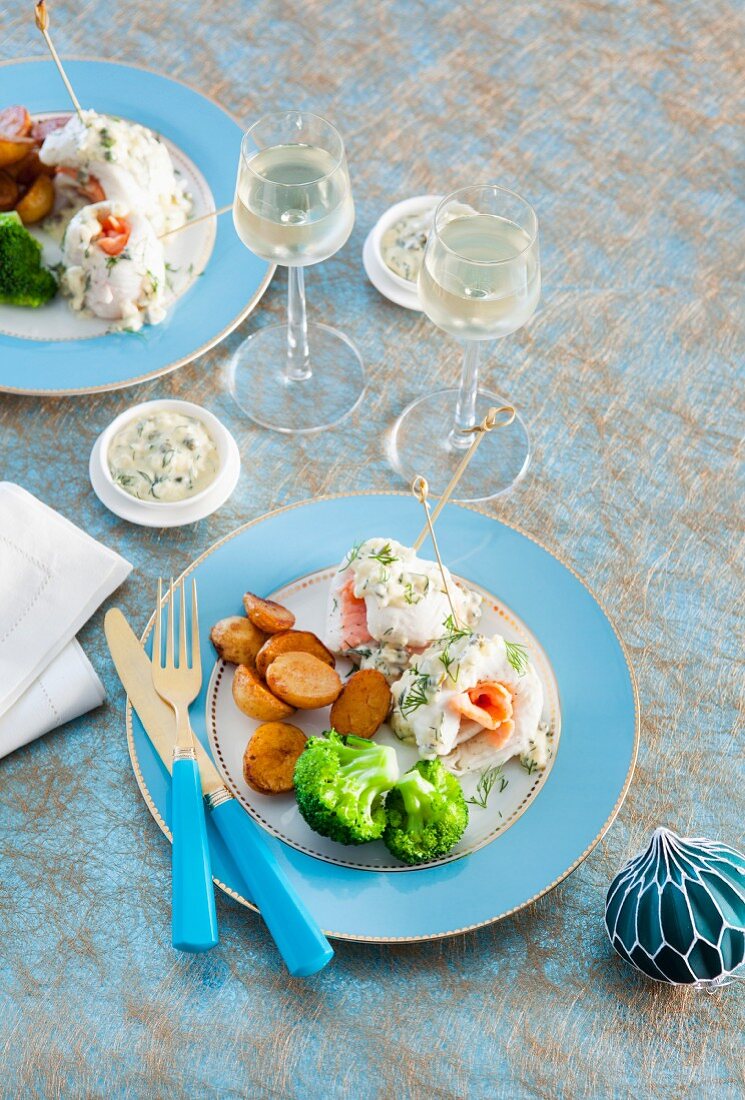 Fish rolls with smoked salmon and a caper and dill sauce for Christmas