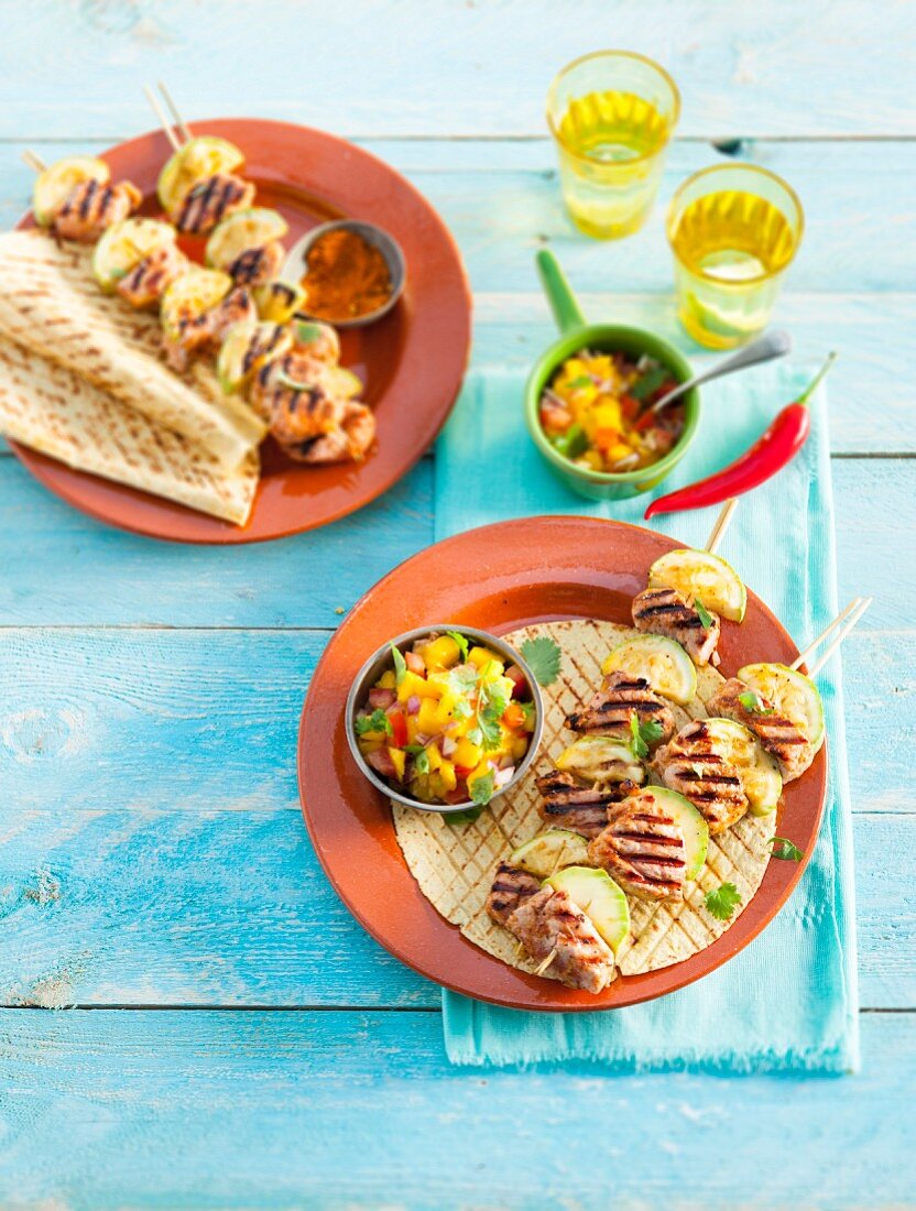 Grilled pork skewers with mango salsa (Mexico)