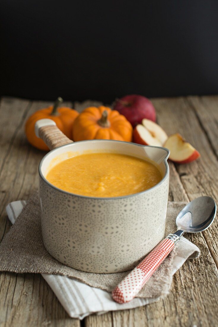 Butternut squash and apple soup in a saucepan