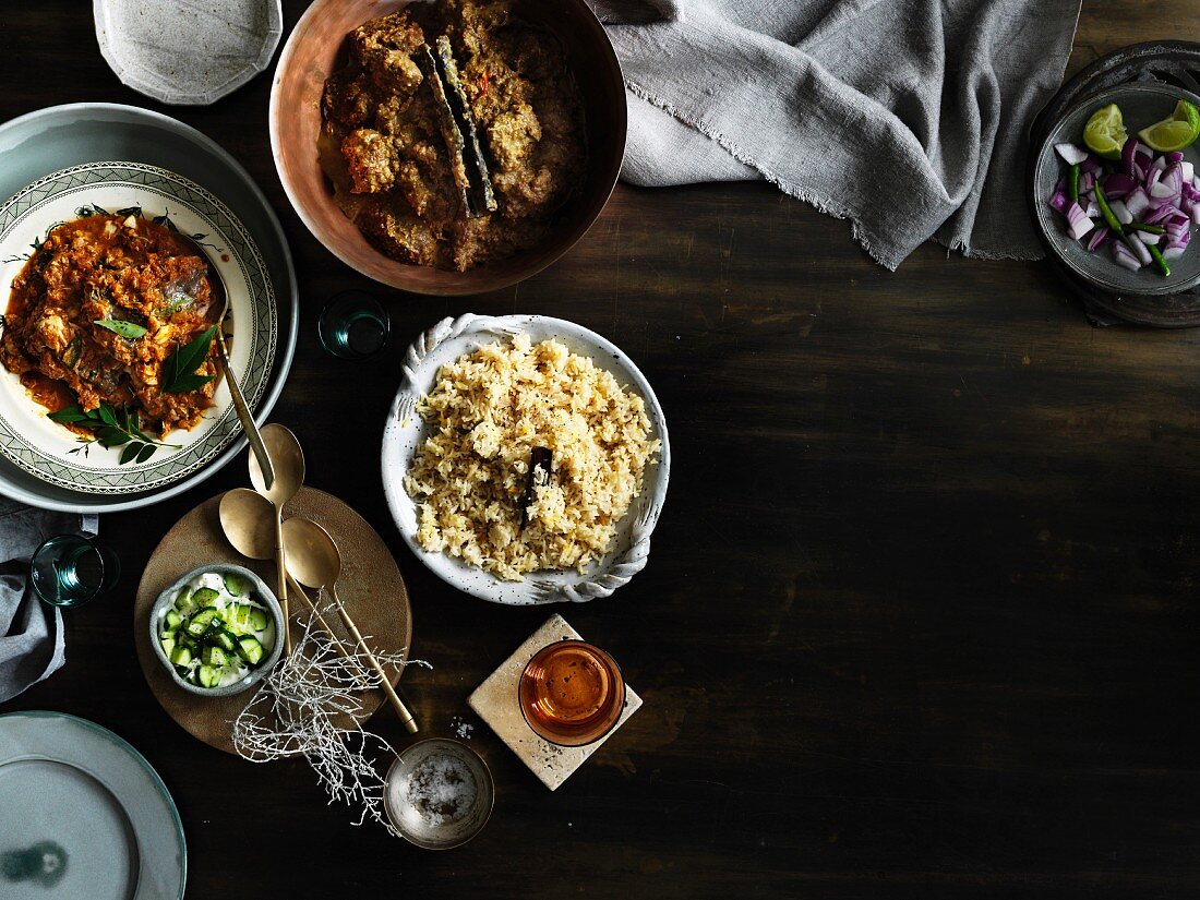 Lamb korma & sour barramundi curry with side dishes (Asia)