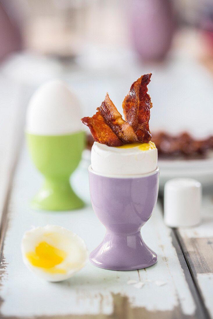 A soft boiled egg and bacon for an Easter breakfast