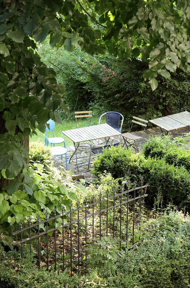 Table and chairs in wild garden