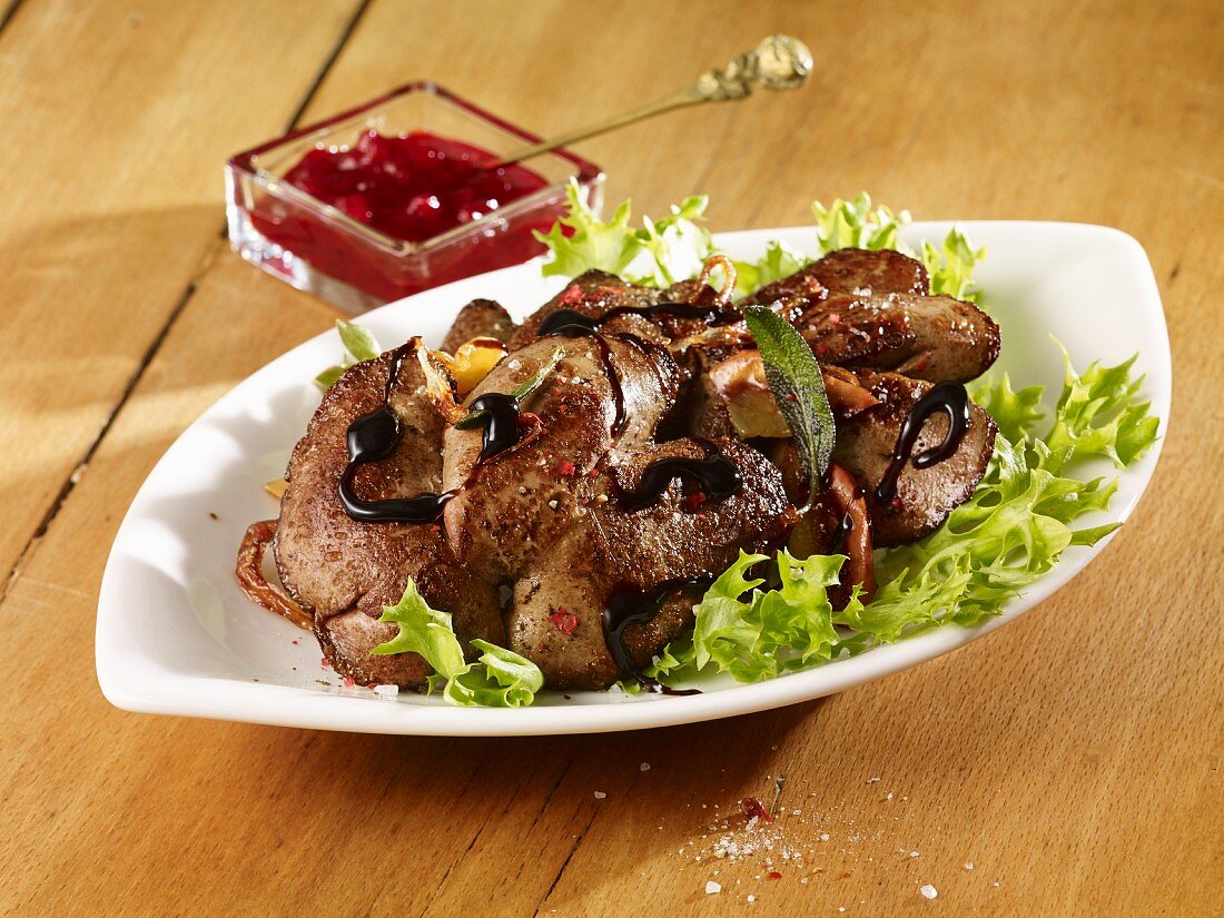 Rabbits liver salad with lingonberry compote and balsamic vinegar