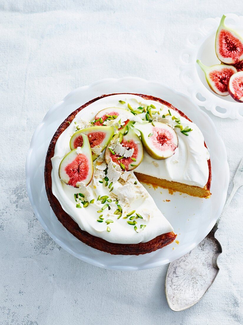 Almond cake with yoghurt cream, fresh figs and pistachio nuts