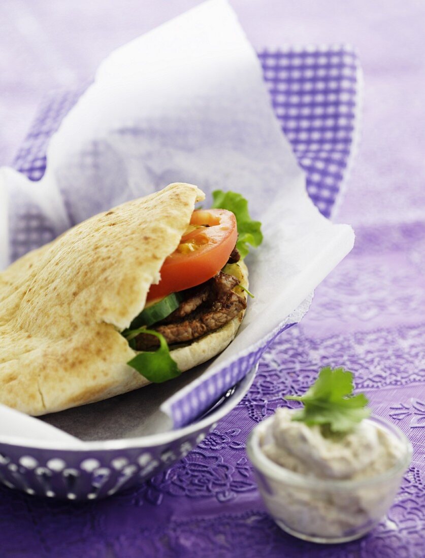 Pita bread filled with lamb and tomato