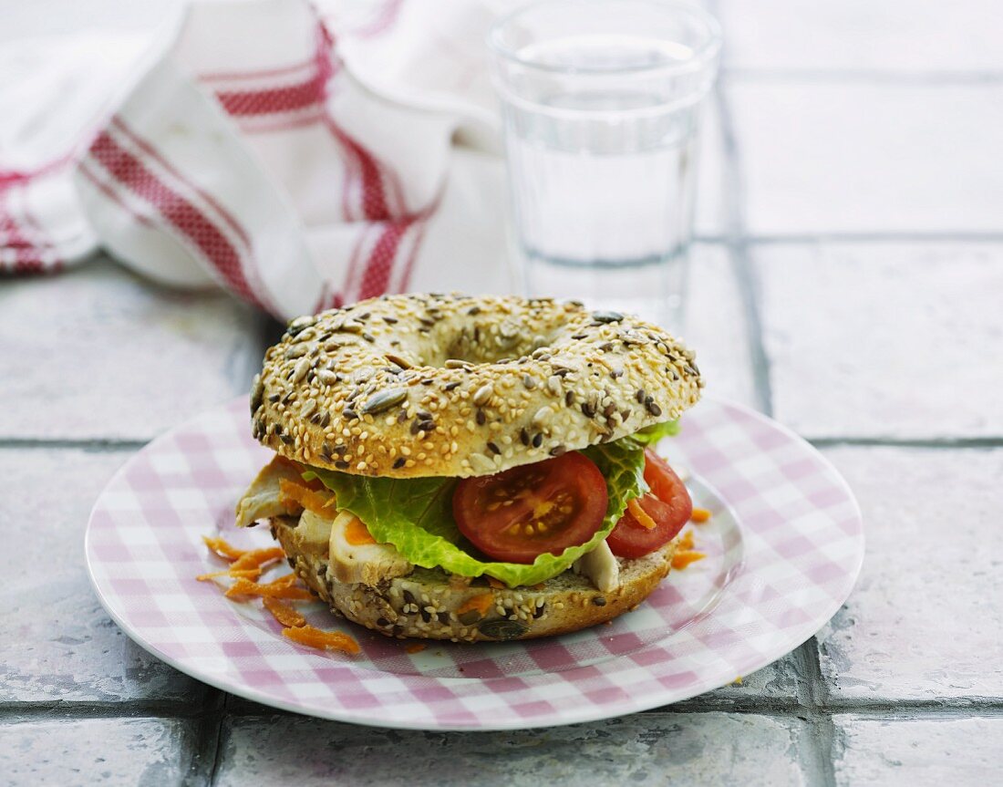 A chicken and tomato bagel