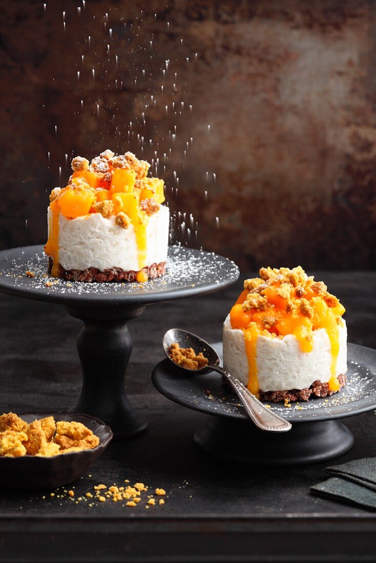 Coconut rice cakes with mango and peanut curry crumbles