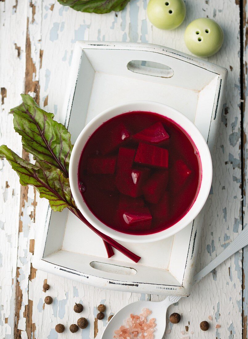 Borscht in a soup bowl on a tray