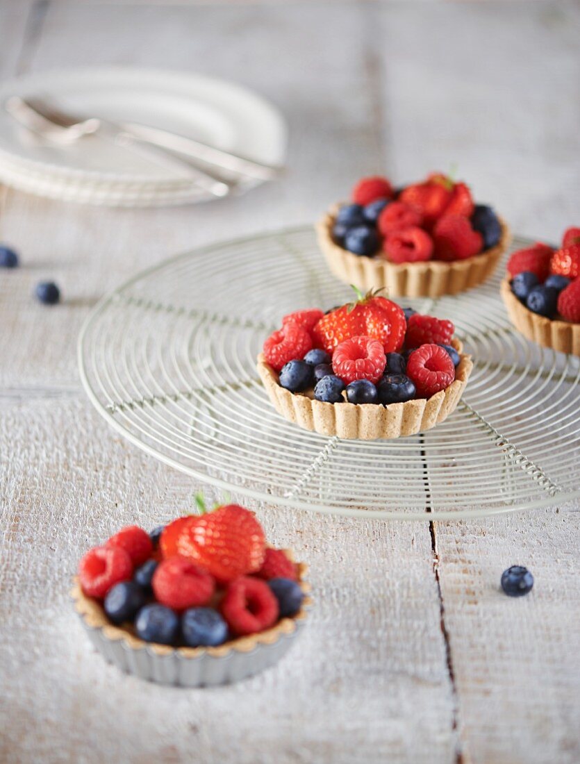 Berry tartlets on a cooling rack