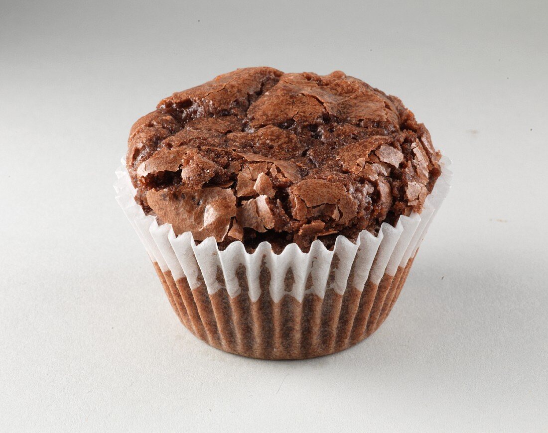 A chocolate muffin in a paper case