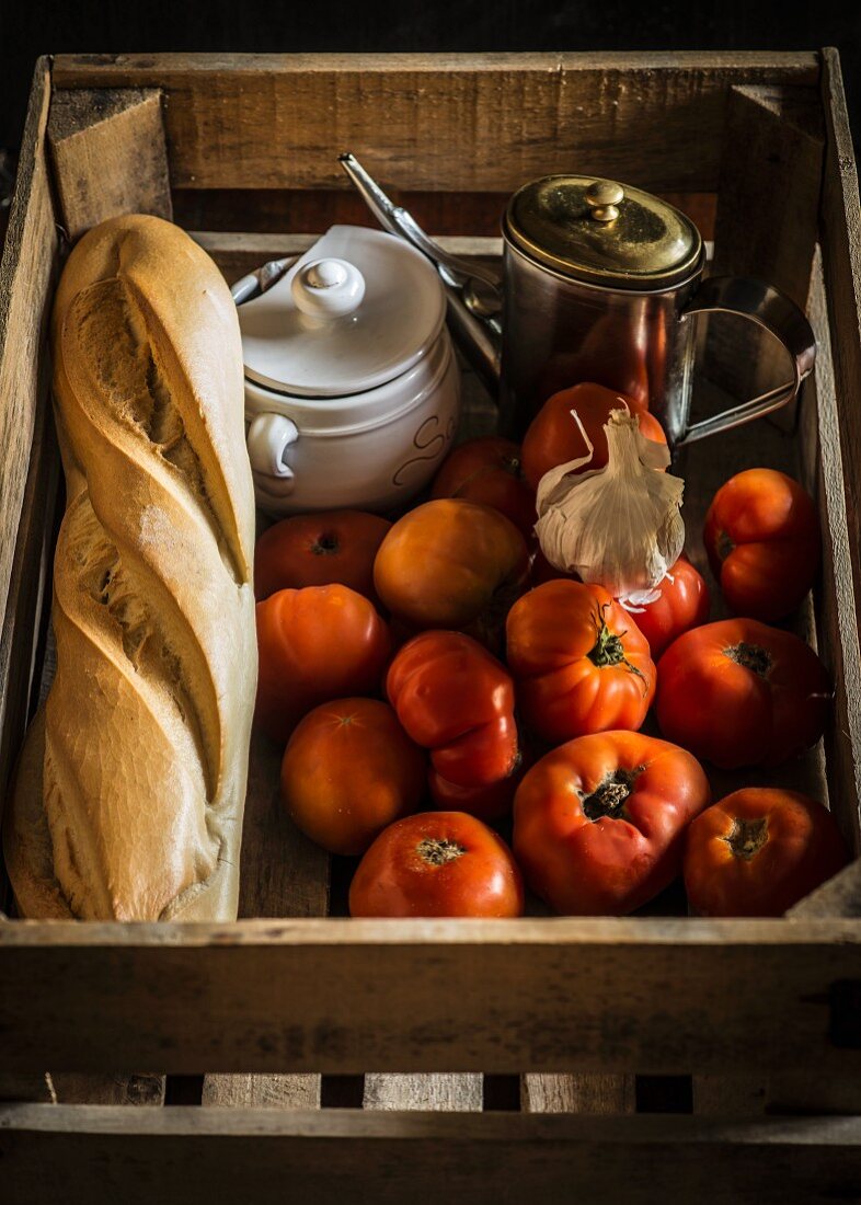 Ingredients for gazpacho in a wooden crate