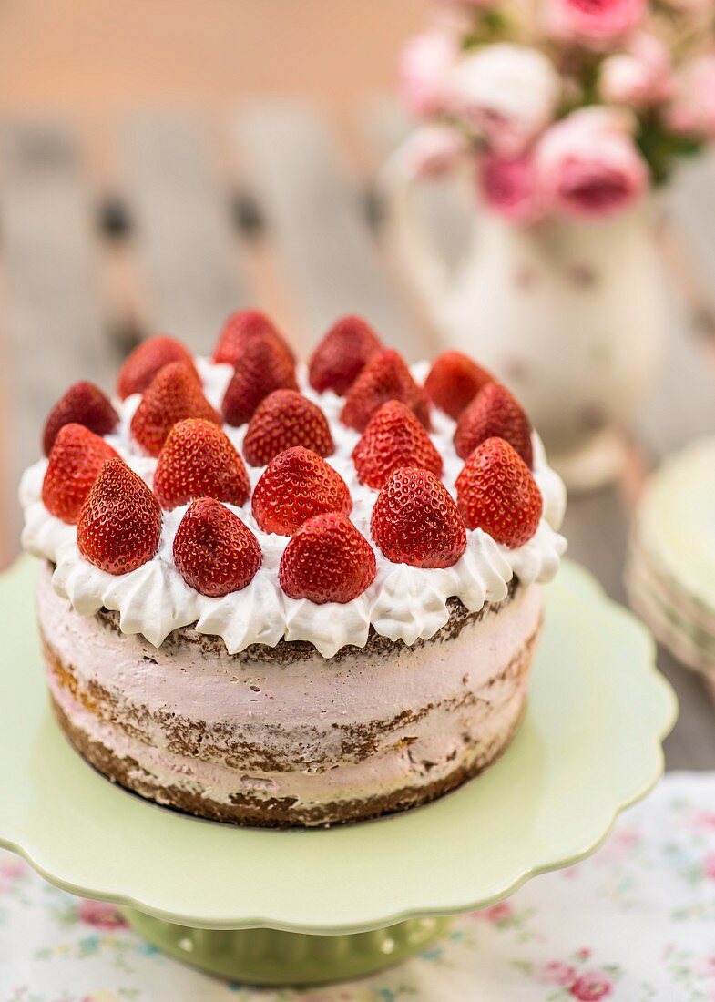 Strawberry cream cake on cake stand